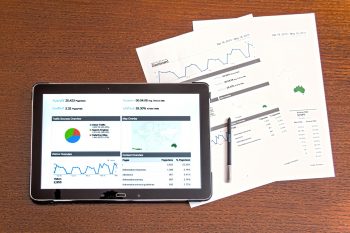 Data displayed on a tablet and print outs.