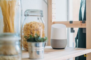 A Google Home device on a kitchen worktop.
