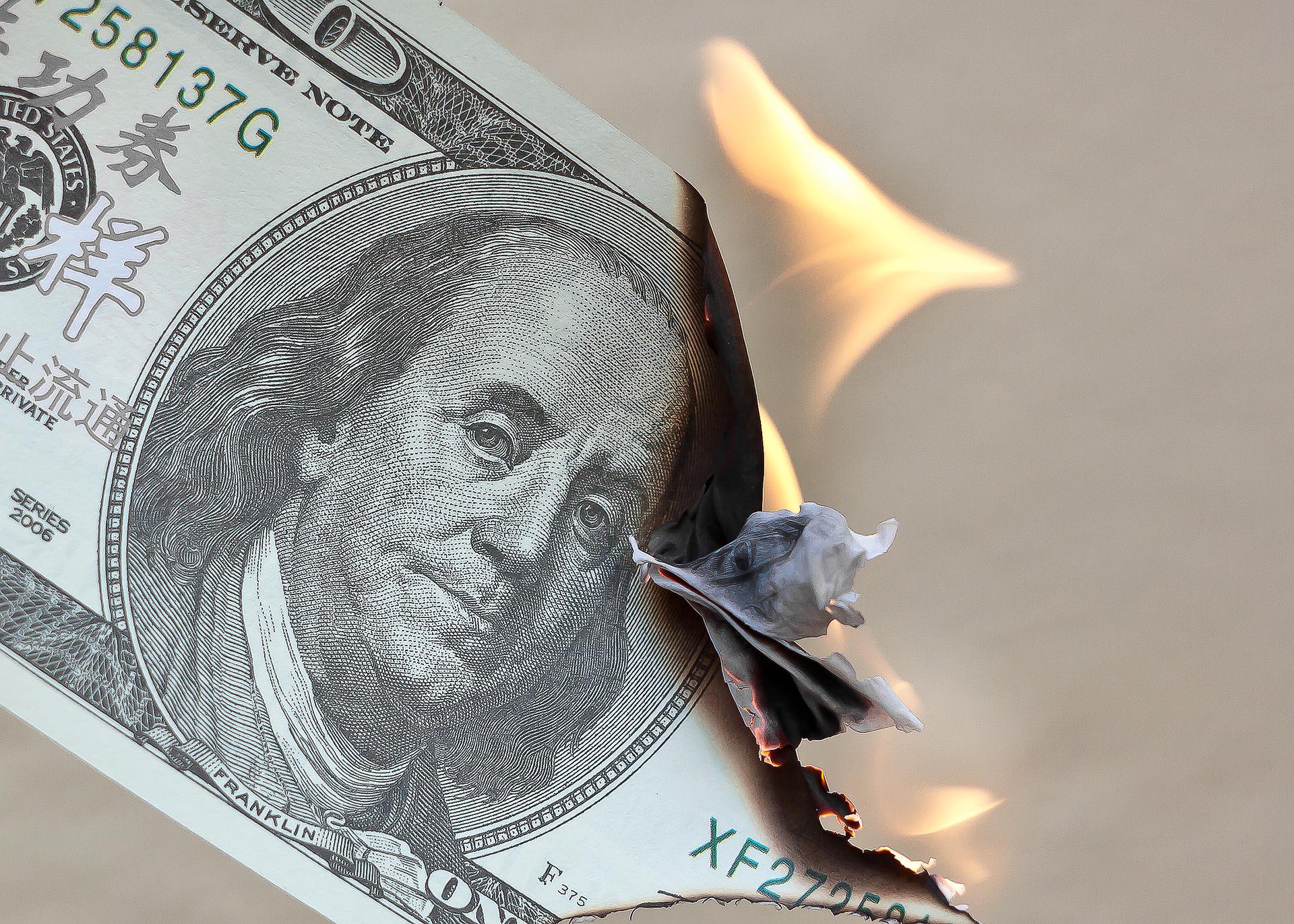 A burning dollar note.