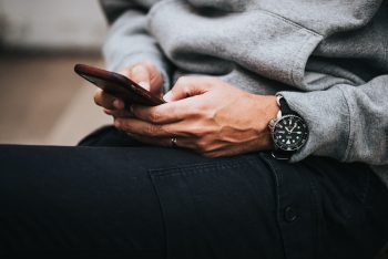 Someone texting with a smartphone.