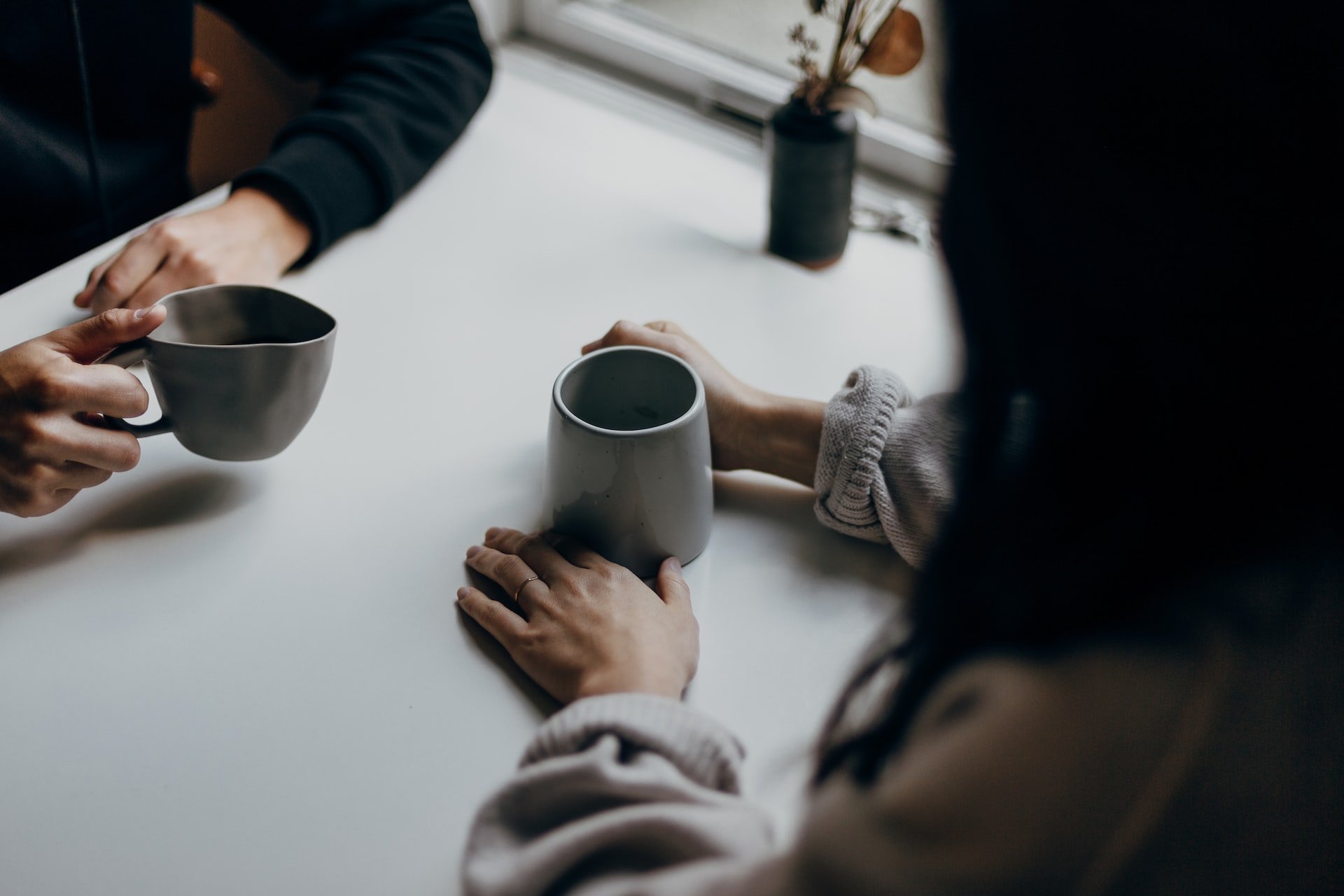 Two people drinking coffee.